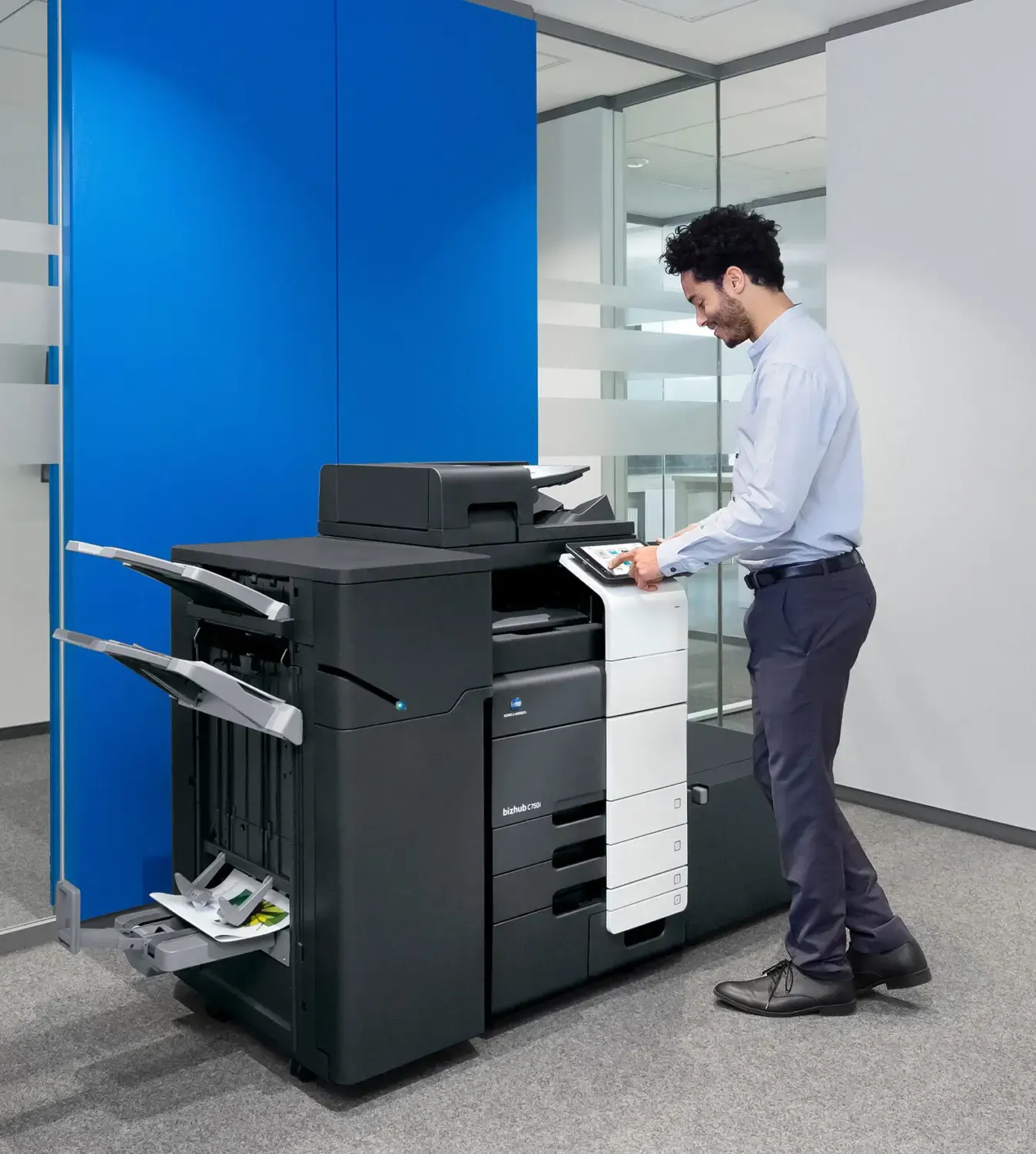 Man using a copier after getting copier repair services in Warrington
